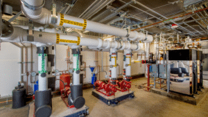 Industrial boiler system with labeled hot water supply and return lines protected by oxygen scavenger treatment.