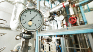 Pressure gauge on industrial boiler system treated with oxygen scavenger chemicals