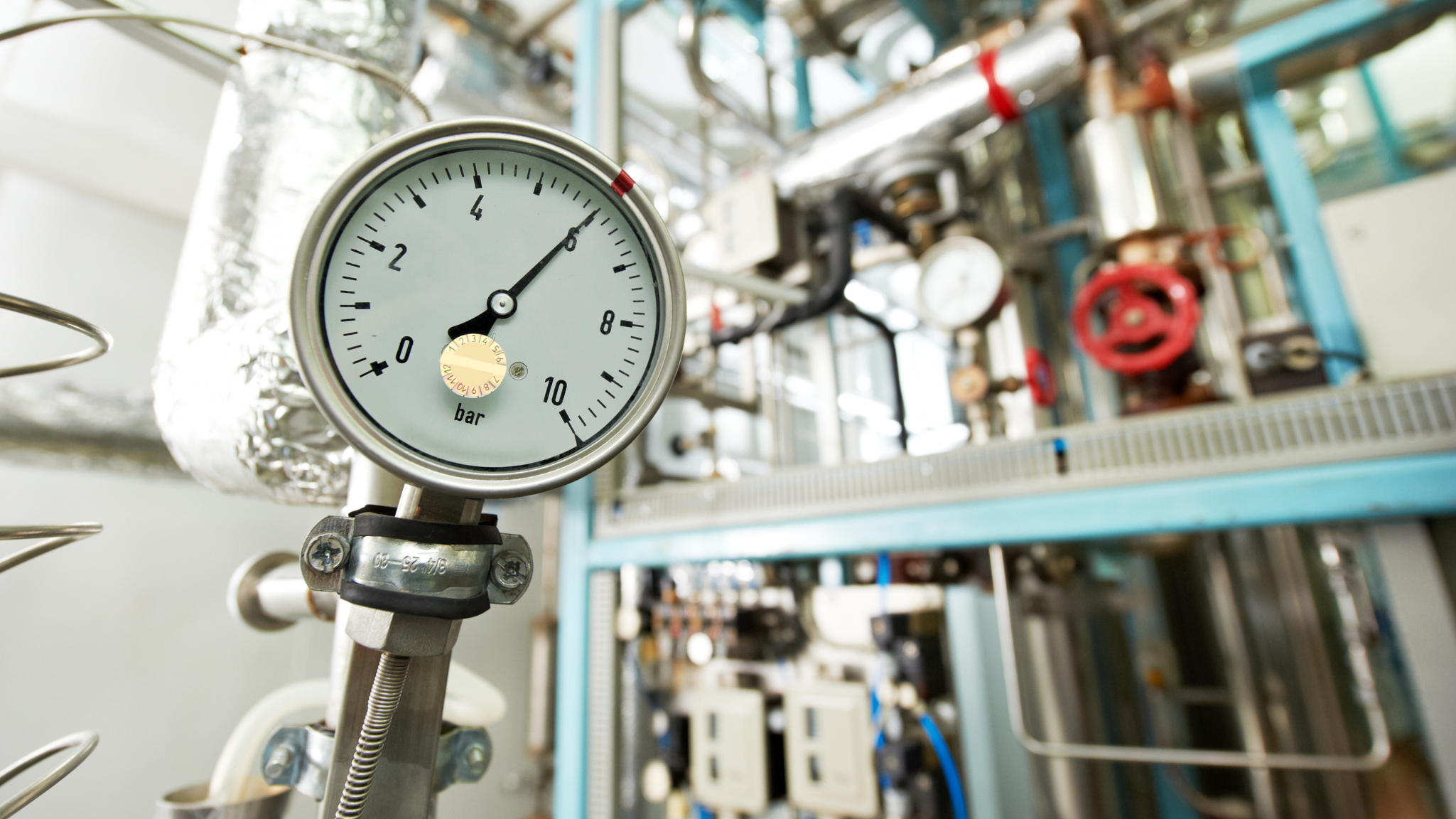 Pressure gauge on industrial boiler system treated with oxygen scavenger chemicals