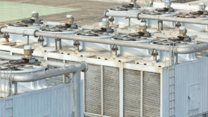 Industrial adiabatic cooling towers with fan units and coil sections for efficient heat transfer"