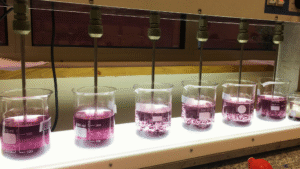 Jar test experiment demonstrating advanced coagulation methods for industrial wastewater treatment in a laboratory setup