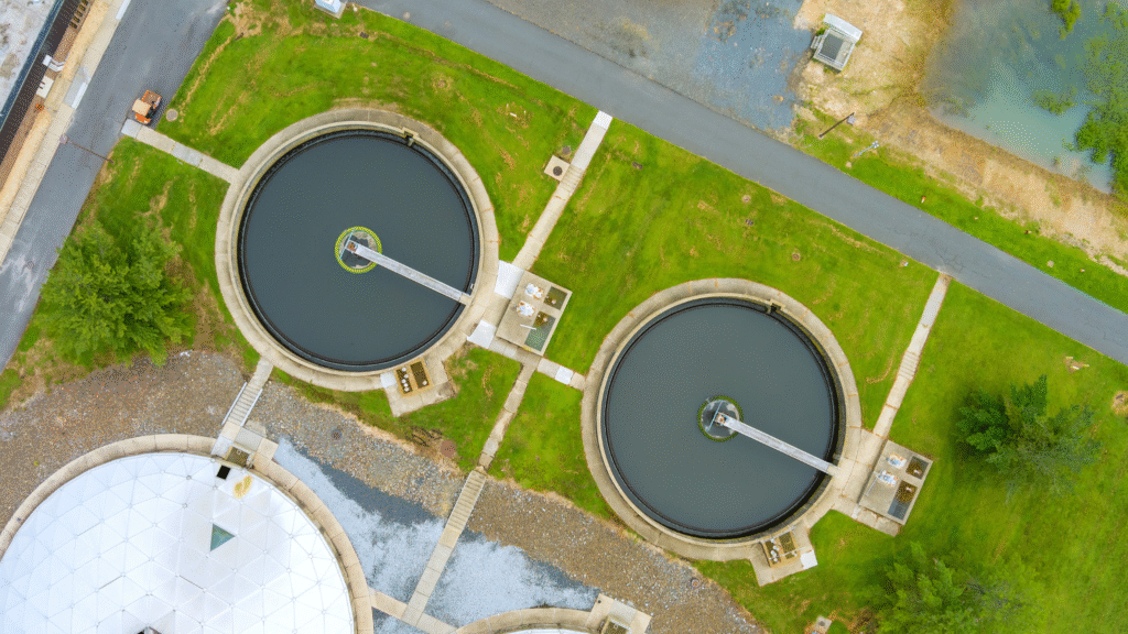 Aerial view of circular clarifier tanks used in industrial oil wastewater treatment systems for clean and compliant discharge