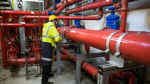 Technician inspecting industrial water treatment piping for Oxidation Potential (ORP) control