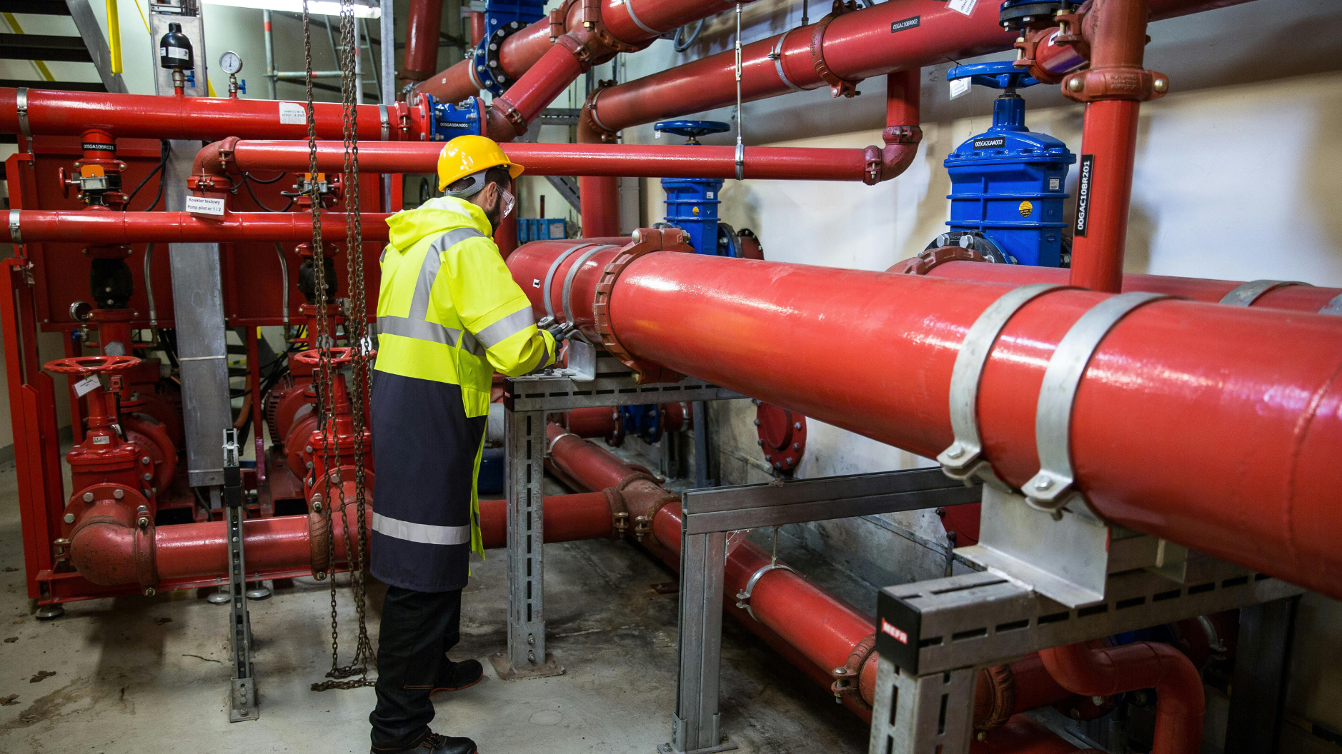 Technician inspecting industrial water treatment piping for Oxidation Potential (ORP) control