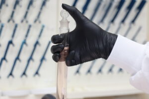 Water testing sample used to compare chlorine vs bromine in water treatment systems