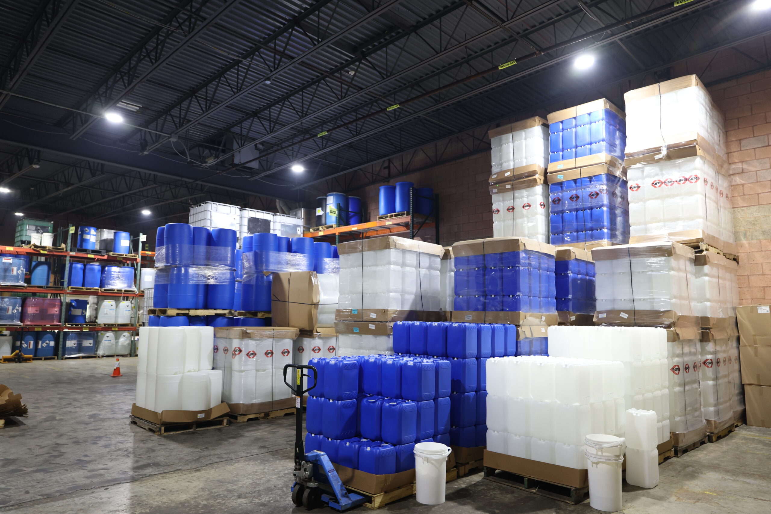Industrial warehouse storing water treatment chemistry products and treatment chemicals