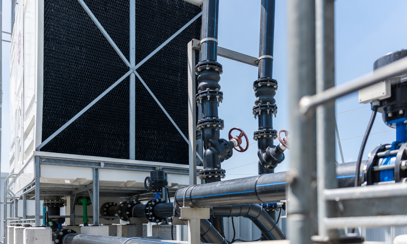 Industrial cooling tower system where bromine water treatment is used to control bacteria and maintain water quality