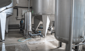 Industrial tanks and piping system used for microbial control in water treatment