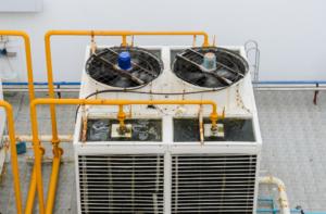 Open recirculating cooling towers require routine cleaning, microbial treatment, and monitoring to control biological accumulation on wetted surfaces.