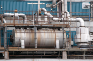 Industrial boiler and piping system used in citric acid water treatment applications for removing mineral scale and maintaining equipment efficiency.