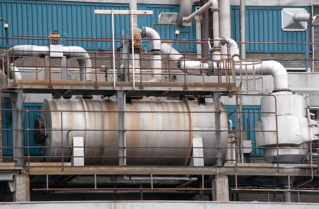 Industrial boiler and piping system used in citric acid water treatment applications for removing mineral scale and maintaining equipment efficiency.