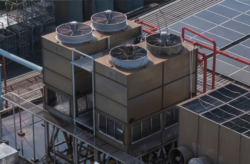 Industrial cooling towers supported by non-oxidizing biocide water treatment programs